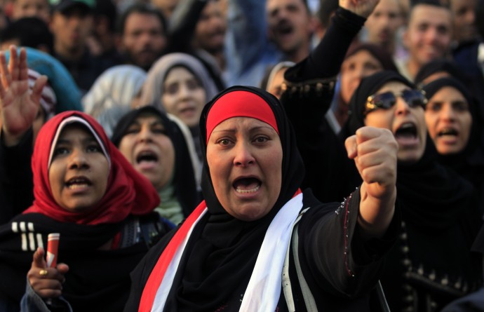 Protesters chant slogans at a rally honoring those killed in clashes with security forces in Tahrir Square in Cairo, Egypt, Friday, Jan. 20, 2012, nearly a year after the 18-day uprising that ousted President Hosni Mubarak. (AP Photo/Khalil Hamra)