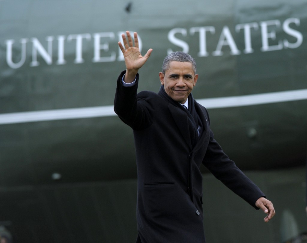 President Barack Obama waves after stepping off Marine One on the South Lawn of the White House in Washington, Wednesday, Jan. 4, 2012, after returning from a trip to Cleveland. (AP Photo/Susan Walsh)