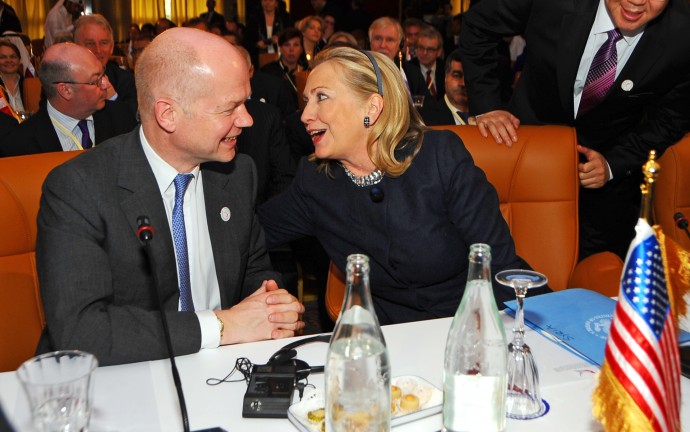 US Secretary of State Hillary Rodham Clinton sits next to British foreign minister William Hague, left, at the start of the Conference on Syria in Tunis, Tunisia, Friday Feb. 24, 2012. The birthplace of the Arab Spring is hosting a landmark conference on Syria by high-level U.S., European, Turkish and Arab League officials. (AP Photo/Hassene Dridi)