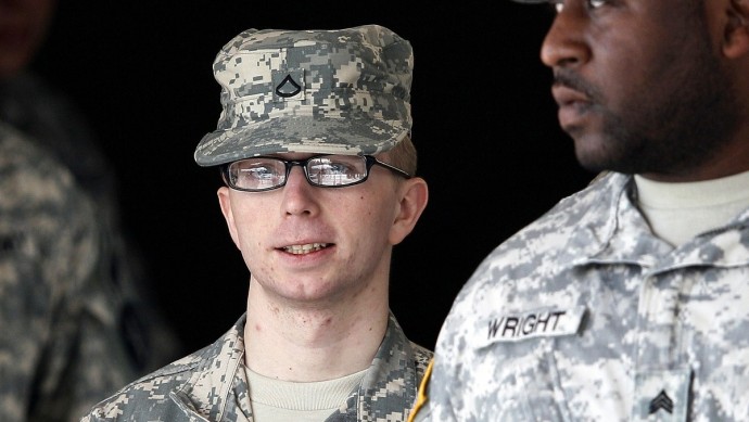 Army Pfc. Bradley Manning, left, is escorted from a courthouse in Fort Meade, Md., Thursday, Dec. 22, 2011, after closing arguments concluded in a military hearing that will determine if he should face court-martial for his alleged role in the WikiLeaks classified leaks case. (AP Photo/Patrick Semansky)