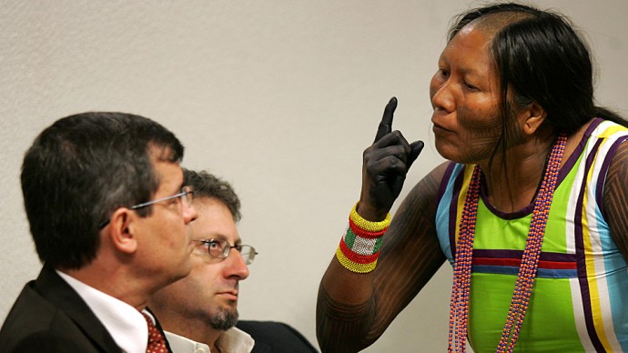 Tuira Kayapo, right, leader of the indigenous Kayapo tribe, speaks to Aloysio Guapindaia, left, director of the National Indian Foundation, FUNAI, during a public hearing at the Commission of Human Rights of the Federal Senate in Brasilia, Wednesday, Dec. 2, 2009. Native communities of the Amazon rain forest are protesting the Brazilian government's decision to build the massive hydroelectric Belo Monte dam in the Xingu River. (AP Photo/Eraldo Peres)