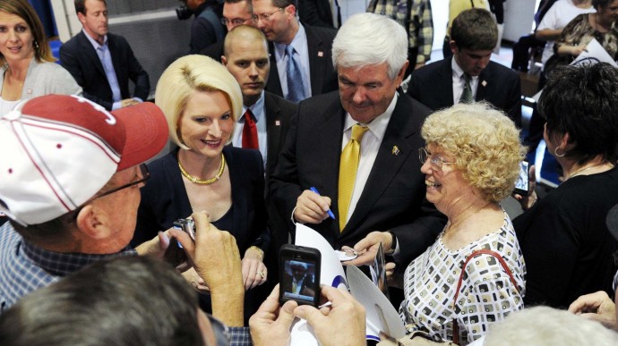 Republican presidential candidate Newt Gingrich and wife Callista sign autographs for supporters after a rally at the Pell City Civic Center Wednesday, March 7, 2012 in Pell City, Ala. (AP Photo/The Birmingham News, Hal Yeager) MAGS OUT