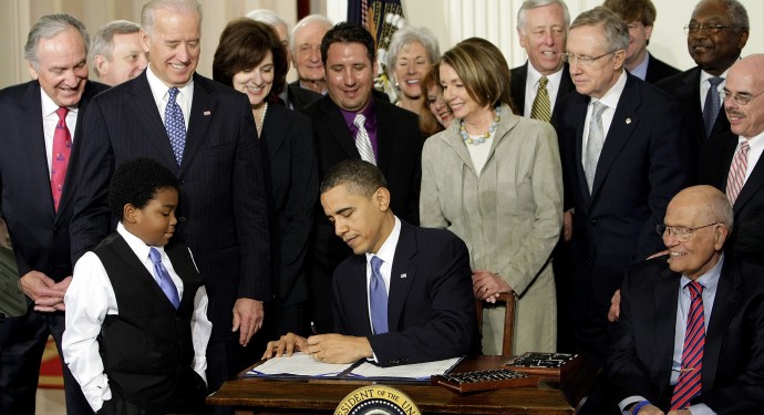 In this March 23, 2010 file photo, President Barack Obama signs the Affordable Care Act in the East Room of the White House in Washington. (AP Photo/J. Scott Applewhite, File)