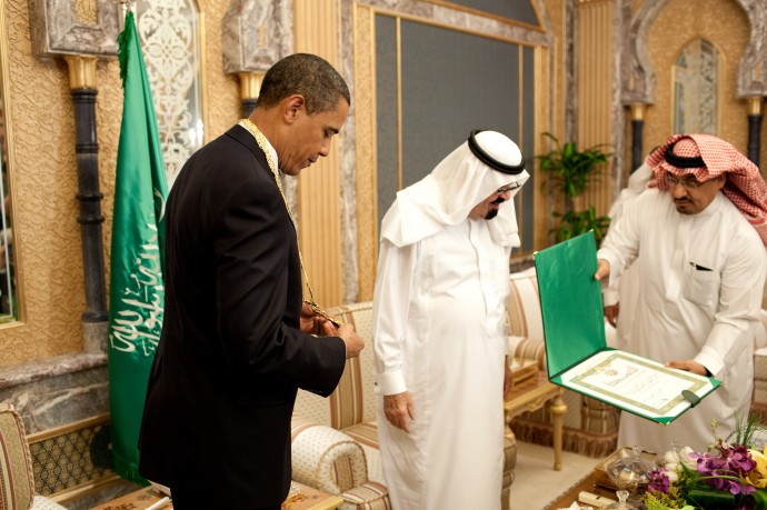 President Barack Obama looks at the King Abdul Aziz Order of Merit presented to him by Saudi King Abdullah bin Abdul Aziz at the start of their bilateral meeting at the King's Farm in Riyadh, Saudi Arabia, June 3, 2009. The medal is Saudi Arabia's highest honor. (Official White House photo by Pete Souza)