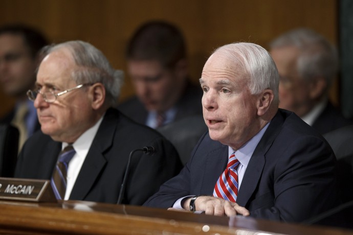 Sen. John McCain, R-Ariz., the ranking Republican on the Senate Armed Services Committee, right, joined by committee chairman, Sen. Carl Levin, D-Mich., questions Defense Secretary Leon Panetta on the crisis in Syria, Wednesday, March 7, 2012, on Capitol Hill in Washington. (AP Photo/J. Scott Applewhite)