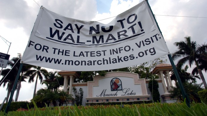 Residents of a Miramar, Fla. community show their opposition to a planned Wal-Mart super store, Thursday, May 12, 2005. (AP Photo/J. Pat Carter)