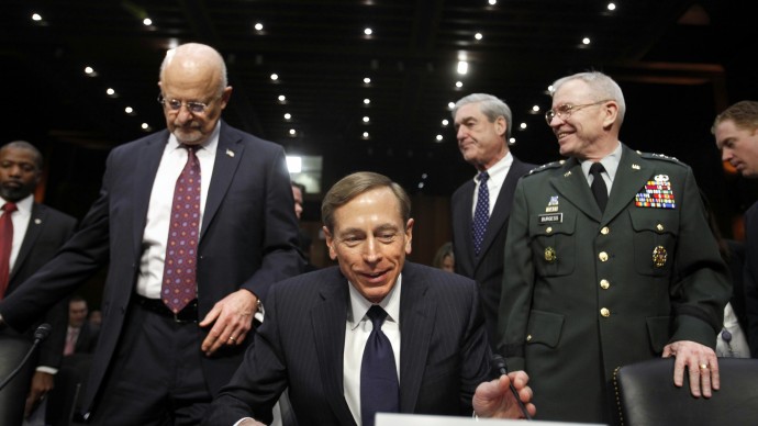 From left, Director of National Intelligence James Clapper, CIA Director David Petraeus, FBI Director Robert Mueller, and Defense Intelligence Agency Director Lt. Gen. Ronald Burgess take their seats on Capitol Hill  in Washington, Tuesday, Jan. 31, 2012, prior to testifying before the Senate Intelligence Committee hearing to assess current and future national security threats. (AP Photo/Jacquelyn Martin)
