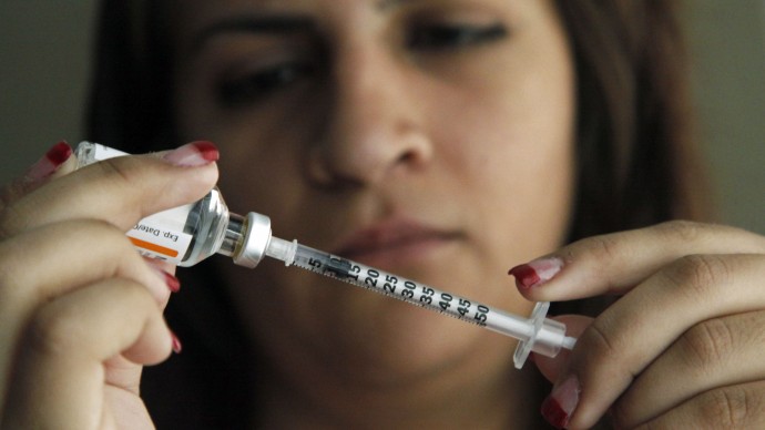 Judith Garcia, 19, fills a syringe as she prepares to give herself an injection of insulin at her home in the Los Angeles suburb of Commerce, Calif., Sunday, April 29, 2012. A major study, released Sunday, tested several ways to manage blood sugar in teens newly diagnosed with diabetes and found that nearly half of them failed within a few years and 1 in 5 suffered serious complications. Garcia still struggles to manage her diabetes with metformin and insulin years after taking part in the study at Children's Hospital Los Angeles. (AP Photo/Reed Saxon)