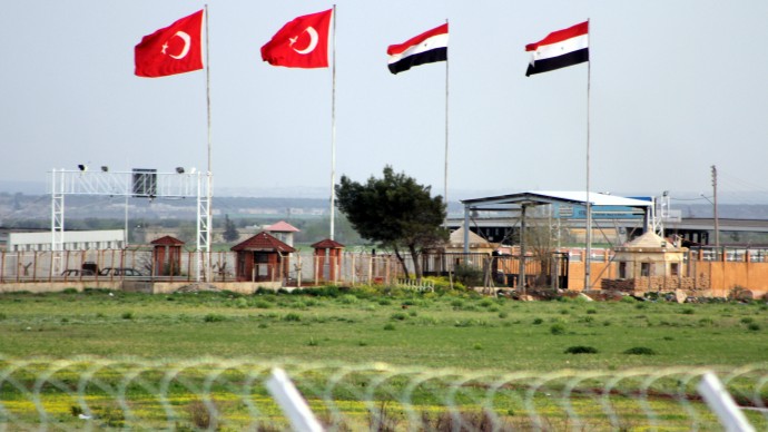 This Tuesday, April 10, 2012, photo shows the border crossing between Turkey and Syria from a refugee camp near the border, in Kilis , Turkey. Turkey's prime minister accused Syria of infringing its border and said Tuesday that his country is considering what steps to take in response. (AP Photo/Germano Assad)