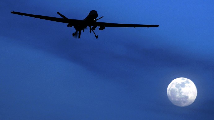 In this Jan. 31, 2010 file photo, an unmanned U.S. Predator drone flies over Kandahar Air Field, southern Afghanistan, on a moon-lit night.(AP Photo/Kirsty Wigglesworth, File)