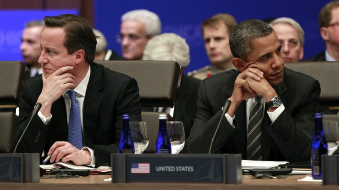 President Barack Obama, right, and British Prime Minister David Cameron, left, sit together at the start of the Partners Meeting at the NATO Summit in Chicago, Monday, May 21, 2012. (AP Photo/Pablo Martinez Monsivais)