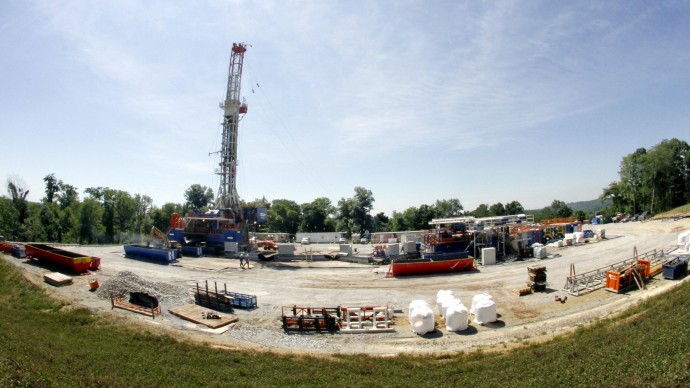 In this July 27, 2011 file photo, the sun shines over a Range Resources well site in Washington, Pa. Germany and the state of Vermont recently banned fracking.. (AP Photo/Keith Srakocic, File)