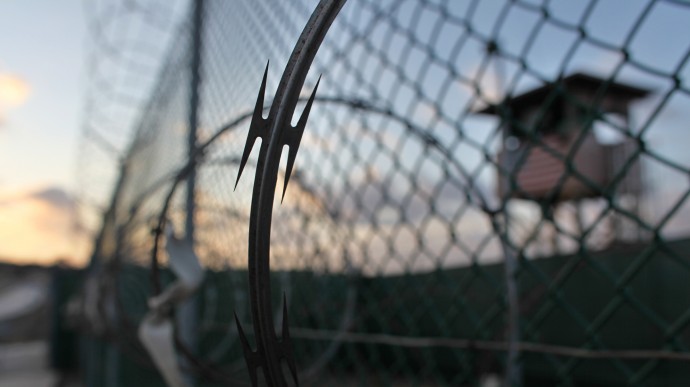 In this May 13, 2009 file photo reviewed by the U.S. military, the sun rises over the Guantanamo detention facility at dawn, at the Guantanamo Bay U.S. Naval Base, Cuba. (AP Photo/Brennan Linsley, file)