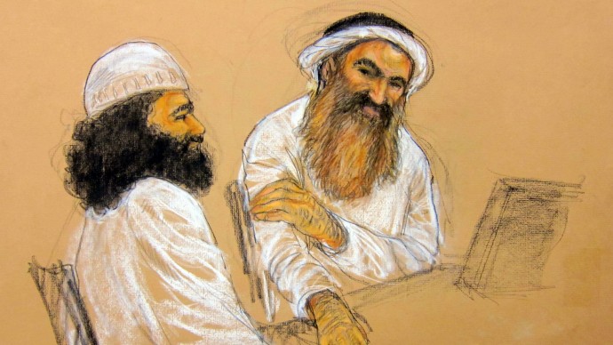 In this photo of a sketch by courtroom artist Janet Hamlin and reviewed by the U.S. Department of Defense, Khalid Sheikh Mohammed, right, and co-defendant  Walid bin Attash   attend military hearing at the Guantanamo Bay U.S. Naval Base in Cuba, Saturday, May 5, 2012. The self-proclaimed mastermind of the Sept. 11 attacks, Khalid Sheikh Mohammed repeatedly declined to respond to a judge's questions Saturday and his co-defendant Walid bin Attash was briefly restrained at a military hearing as five men charged with the worst terror attack in U.S. history appeared in public for the first time in more than three years. (AP Photo/Janet Hamlin, Pool)
