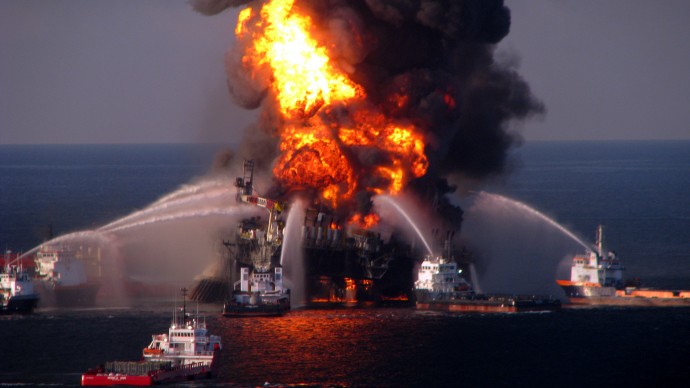  In this April 21, 2010 photo provided by the U.S. Coast Guard, fire boat response crews spray water on the burning remnants of BP's Deepwater Horizon offshore oil rig. (AP Photo/US Coast Guard, File)