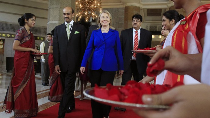 U.S. Secretary of State Hillary Rodham Clinton leaves the Taj Hotel in Kolkata Monday, May 7, 2012. Clinton urged energy-starved India on Monday to reduce its Iranian oil imports to keep up pressure on the Islamic republic to come clean about its nuclear program.   (AP Photo/Shannon Stapleton, Pool)