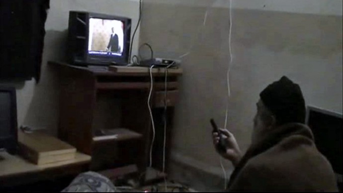 FILE - This undated file image from video seized from the walled compound of al-Qaida leader Osama bin Laden in Abbottabad, Pakistan, and provided by the U.S. Department of Defense shows Osama bin Laden. Osama bin Laden spent his last weeks in a house divided, amid wives riven by suspicions. On the top floor, sharing his bedroom, was his youngest wife and favorite. The trouble came when his eldest wife showed up and moved into the bedroom on the floor below. Pakistan will deport Osama bin Laden's three widows and their children to Saudi Arabia next week after they finish a 45-day prison sentence for illegally entering and living in the country, their defense lawyer said Friday, April 13, 2012. (AP Photo/Department of Defense, File)