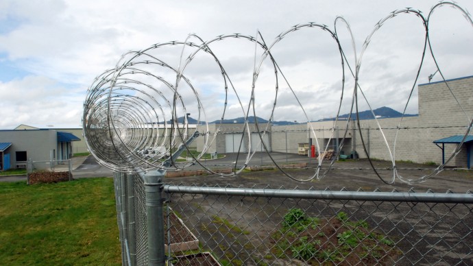 This March 18, 2011 file photo shows razor wire circling the inmate garden at the Josephine County Jail in Grants Pass, Ore. (AP Photo/Jeff Barnard)