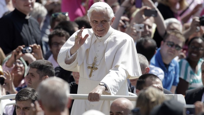 Pope Benedict XVI waves as he arrives for his weekly audience in St. Peter's square at the Vatican, Wednesday, May 30, 2012. (AP Photo/Riccardo De Luca)