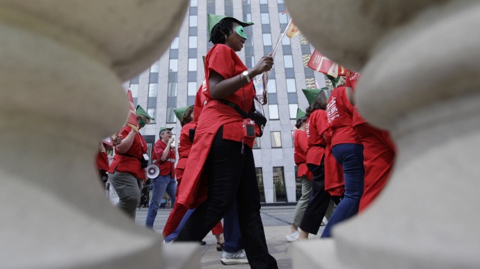 Members of National Nurses United rally at a NATO summit demonstration, Friday, May 18 2012, in Chicago. (AP Photo/Nam Y. Huh)