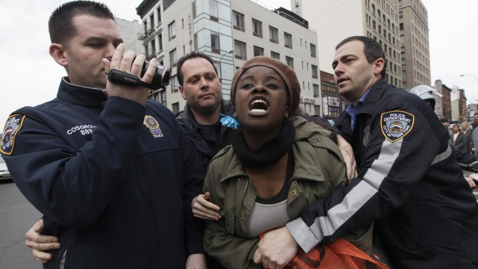 Police officers detain a Occupy Wall Street activist during a march to call for NYPD Police Commissioner Ray Kelly's immediate resignation, Saturday, March 24, 2012 in New York.  (AP Photo/Mary Altaffer)