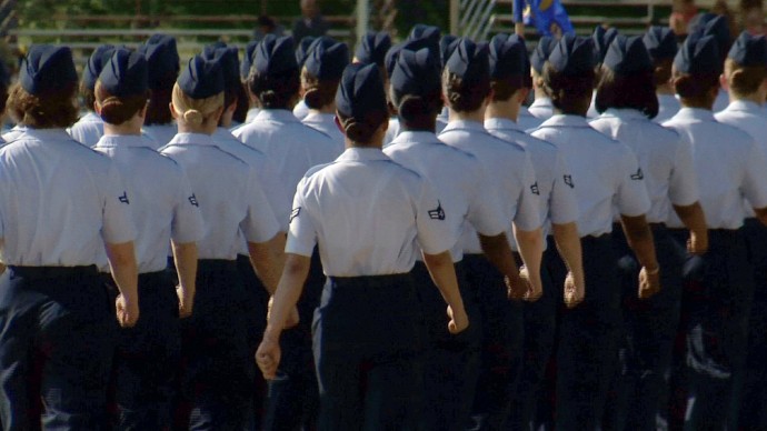 In this June 22, 2012, image made from video, female airmen march during graduation at Lackland Air Force Base in San Antonio. (AP Photo/John L. Mone)