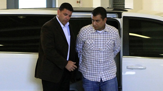 After his bond was revoked, George Zimmerman, right, returns to the John E. Polk Correctional Facility in Sanford, Fla., Sunday, June 3, 2012. Zimmerman is charged with second-degree murder in the shooting of Trayvon Martin. (AP Photo/Orlando Sentinel, Joshua C. Cruey, Pool)