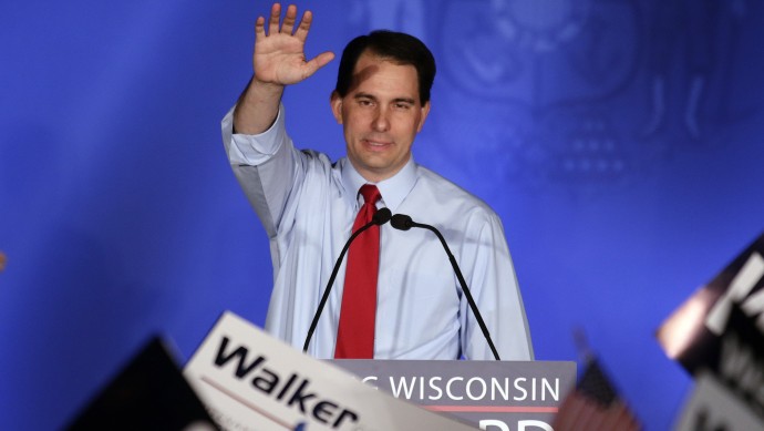 Wisconsin Republican Gov. Scott Walker waves at his victory party Tuesday, June 5, 2012, in Waukesha, Wis. Walker defeated Democratic challenger Tom Barrett in a special recall election. (AP Photo/Morry Gash)