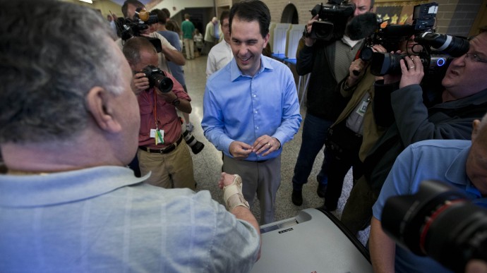 Wisconsin Republican Gov. Scott Walker casts his ballot Tuesday, June 5, 2012, in Wauwatosa, Wis. Walker faces Democratic challenger Tom Barrett in a special recall election. (AP Photo/Morry Gash)