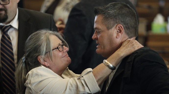 Rep. Dawn Pettengill, R-Mount Auburn, hugs Rep. Lance Horbach, R-Tama, after the House adjourned the 2012 legislative session, Wednesday, May 9, 2012, at the Statehouse in Des Moines, Iowa. (AP Photo/Charlie Neibergall)