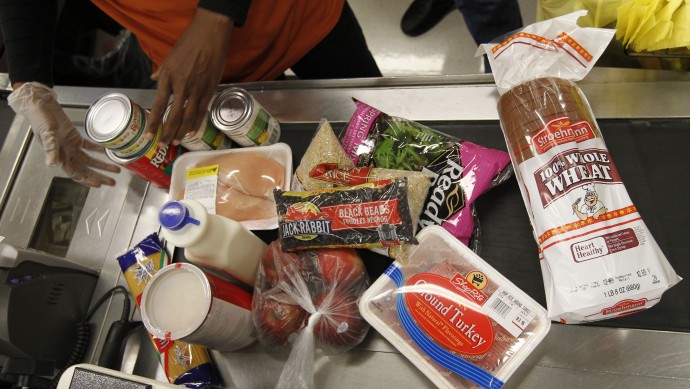Food stamp purchases are scanned by a cashier at a ShopRite grocery story Monday, April 23, 2012, in Philadelphia. (AP Photo/Matt Rourke)