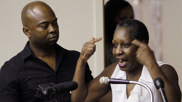 Elaine Riddick, right, is comforted by her son Tony Riddick as she testifies before the Justice for Sterilization Victims Foundation task force compensation hearing in Raleigh, N.C., Wednesday, June 22, 2011. (AP Photo/Jim R. Bounds)