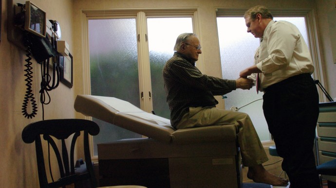 Dr. Winslow Murdoch, right, examines patient Joseph Balinski at his West Chester, Pa. office Wednesday, Nov. 16, 2005. Murdoch doesn't accept any insurance and instead has patients pay him a monthly retainer in an arrangement commonly referred to as a "concierge practice." The result, Murdoch and his patients say, is better, more hands-on care. (AP Photo/Bradley C. Bower)
