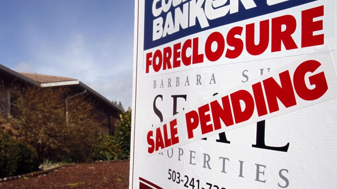 A foreclosed house with sale pending sign is shown in Tigard, Ore., Tuesday, March, 8, 2011. The number of Americans who owe more on their mortgages than their homes are worth rose at the end of last year, preventing many people from selling their homes in an already weak housing market. (AP Photo/Don Ryan)