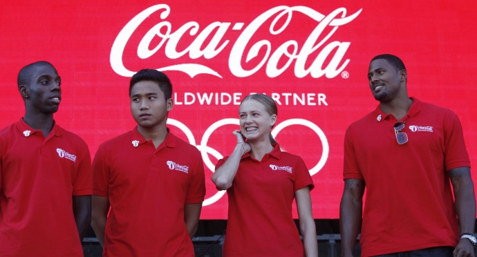 Olympic hopefuls from left, Darius Knight, 21, a British table tennis player, Dayyan Jaffar, 17, an archer from Singapore, Kseniya Vdovina, 24, a 400 metre sprinter from Russia, and David Oliver, 29 a 110 metre hurdler from the United States pose for the photographers during the launch of a global campaign by London 2012 Olympic Games' major sponsor Coca Cola, in East London, Thursday, Sept. 29, 2011. (AP Photo/Lefteris Pitarakis)