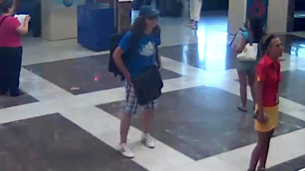 This image taken from security video provided by the Bulgarian Interior Ministry Thursday, July 19, 2012 purports to show the unidentified bomber, center, with long hair and wearing a baseball cap, at Burgas Airport in Burgas, Bulgaria, on Wednesday, July 18, 2012. (AP Photo/Bulgarian Interior Ministry)