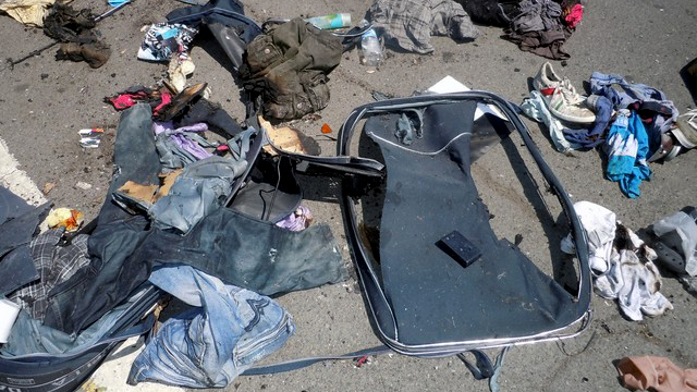 This image provided by the Bulgarian Interior Ministry Thursday July 19, 2012, shows clothing and other debris from a bus following Wednesday's deadly suicide attack on a bus full of Israeli vacationers at the Burgas airport parking lot, Burgas, Bulgaria. (AP Photo/Bulgarian Interior Ministry)