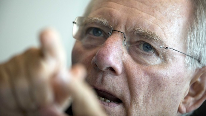 German Finance Minister Wolfgang Schaeuble gestures before a meeting of the CDU/CSU Parliamentary Group prior to a special session of the Germany Parliament Bundestag in Berlin, Germany, Thursday, July 19, 2012. (AP Photo/Gero Breloer)