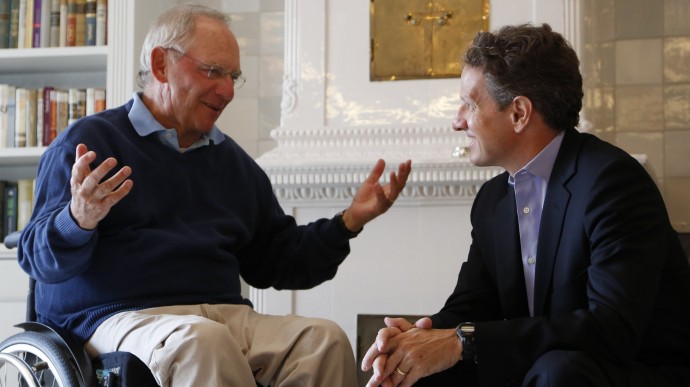German Finance Minister Wolfgang Schaeuble, left, speaks with U.S. Treasury Secretary Timothy Geithner, right, in the house where Schaeuble is vacationing, in Westerland on the North Sea island of Sylt, Germany Monday July 30, 2012. (AP Photo/dapd/ Philipp Guelland)