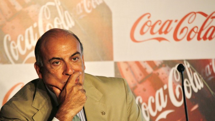 Muhtar Kent, left, Chairman and CEO of The Coca-Cola Company watches during a meeting in New Delhi, India, Tuesday, June 26, 2012. (AP Photo/Manish Swarup)