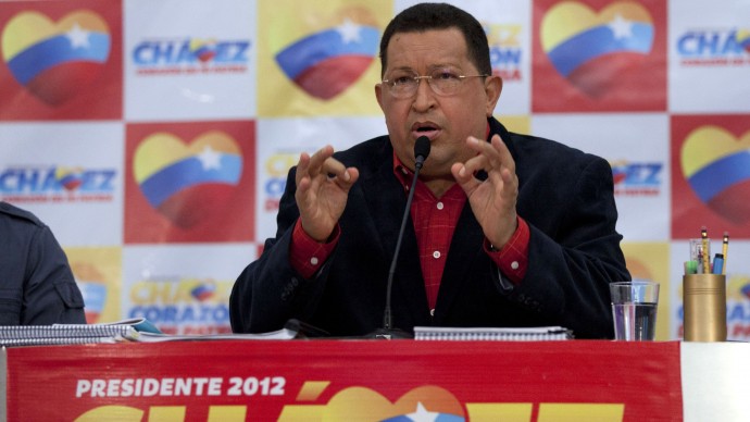 Venezuela's president Hugo Chavez speaks during a news conference, his first as presidential candidate of the United Socialist Party of Venezuela for the upcoming elections, in Caracas, Venezuela, Monday, July 9, 2012. Venezuelans will go to the polls October 7. (AP Photo/Ariana Cubillos)