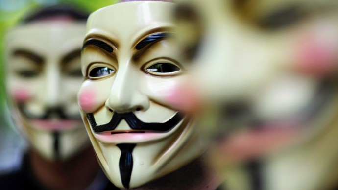 Activists of the international network "Anonymous" pose behind their masks August 14,2008. (Photo Michael Gottschalk/dapd)