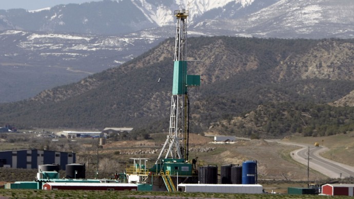 A natural gas well pad sits in front of the Roan Plateau near the Colorado mountain community of Rifle in this file photograph taken on Tuesday, April 22, 2008. (AP Photo/David Zalubowski, file)