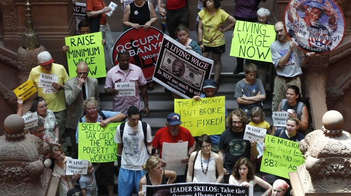 Occupy protesters rally for a raise in the state's minimum wage on the Great Western Staircase at the Capitol in Albany N.Y., on Tuesday, May 29, 2012. (AP Photo/Mike Groll)