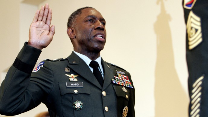 In this May 26, 2006 file photo, Army Lt. Gen. William E. Kip Ward is administered the oath of four-star General, the Army's highest rank of general, by Command Sgt. Major Mark Ripka, right, at Fort Myer, Va. (AP Photo/Caleb Jones, File)