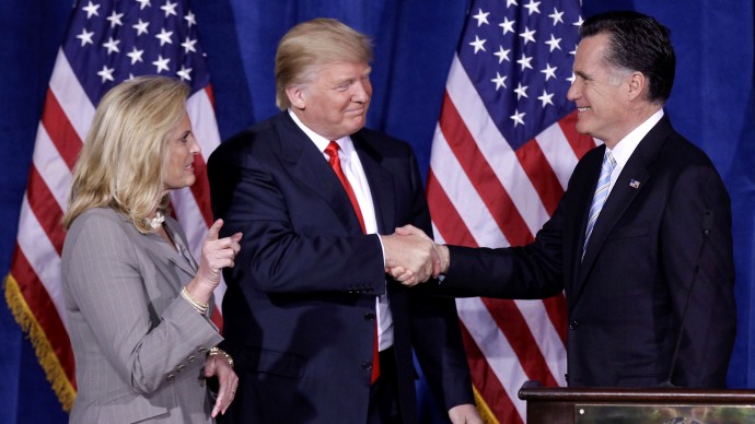 In this Thursday, Feb. 2, 2012 file photo, Donald Trump greets Republican presidential candidate, former Massachusetts Gov. Mitt Romney, after announcing his endorsement of Romney during a news conference in Las Vegas. (AP Photo/Julie Jacobson, File)
