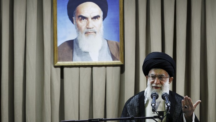 In this photo released by an official website of the Iranian supreme leader's office and taken on Tuesday, July 24, 2012, Iranian supreme leader Ayatollah Ali Khamenei delivers a speech under a portrait of late revolutionary founder Ayatollah Khomeini, in Tehran, Iran. (AP Photo/Office of the Supreme Leader)