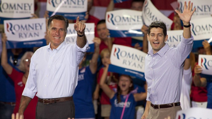 Republican presidential candidate Mitt Romney, left, and his vice presidential running mate Rep. Paul Ryan, R-Wis., arrive at a campaign rally Sunday, August 12, 2012 in Mooresville, N.C. at the NASCAR Technical Institute. (AP Photo/Jason E. Miczek)