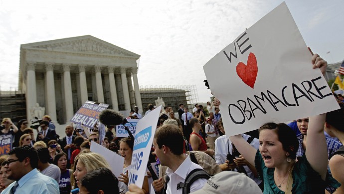 In this June 28, 2012 file photo, supporters of President Barack Obama's health care law celebrate outside the Supreme Court in Washington. (AP Photo/David Goldman, File)