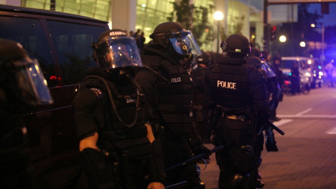 Police in Denver, Colo. stay on duty at a riot in 2008. (Photo Alison Klein, WEBN News via flikr)